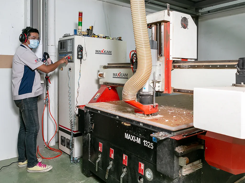 staff operating on cnc router