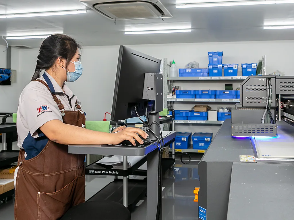 staff operating on uv printing machine