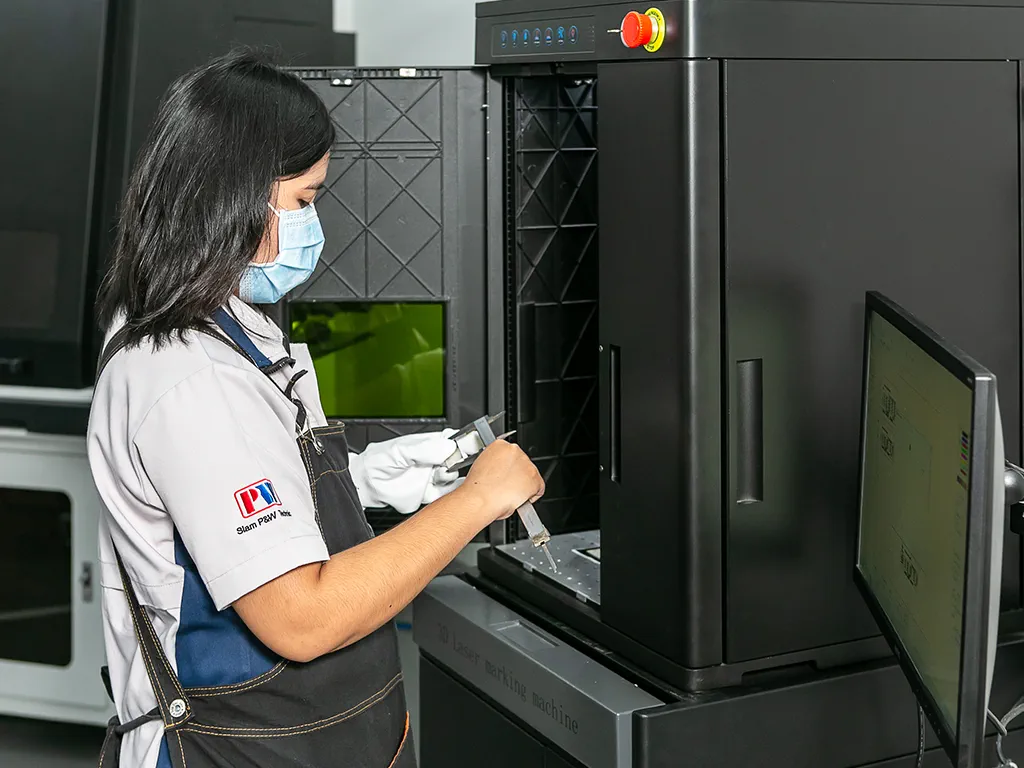 staff operating on laser marking machine