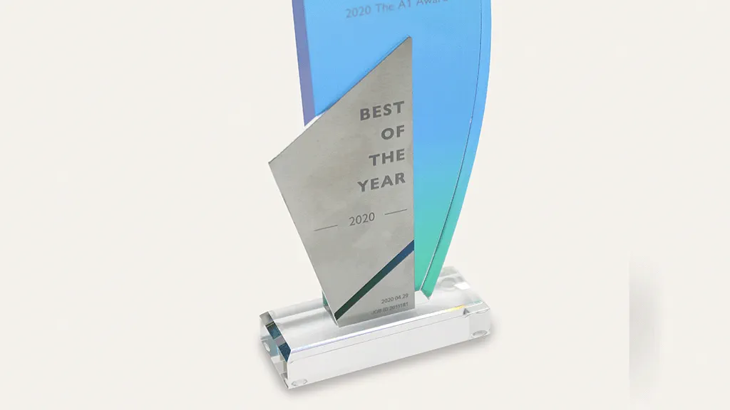 photo of trophy with stainless steel piece being uv glued to acrylic