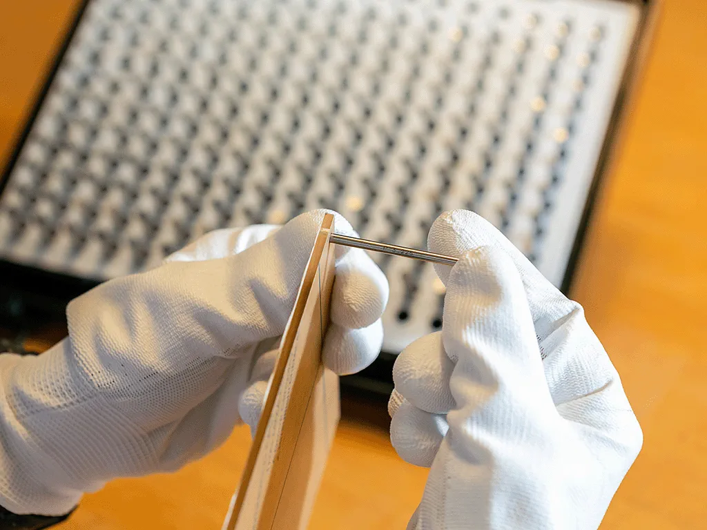 photo of measuring hole diameter using eisen pin gauge
