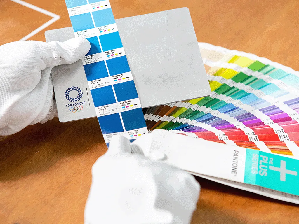 photo of checking color consistency using pantone color swatch