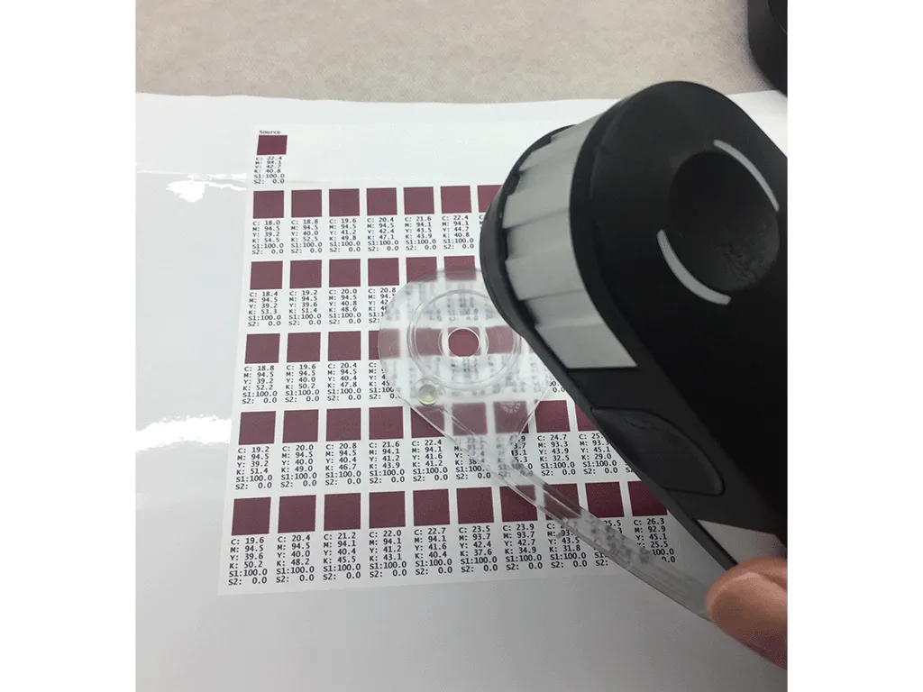 photo of measuring color consistency using x-rite i1 pro color meter