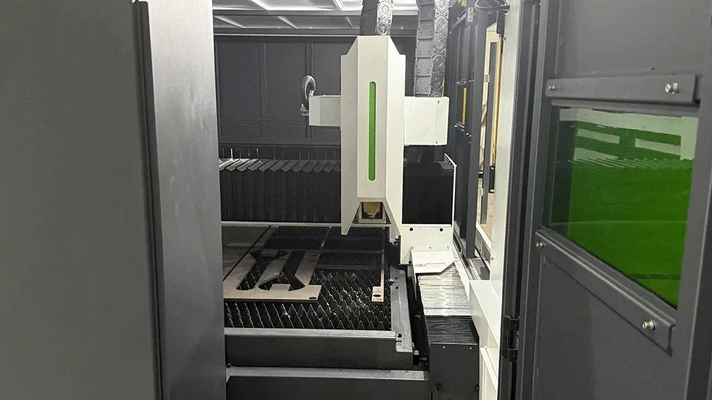 Photo of close-up view of fiber laser cutting head in operation