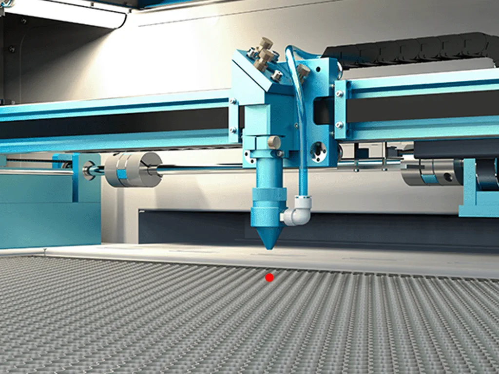 Close-up photo of visible red dot guide of NOVA laser cutting machine