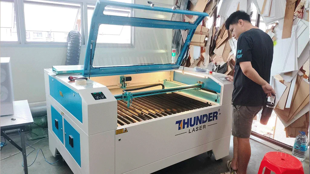 Photo of customer happy about their new Thunder Laser machine