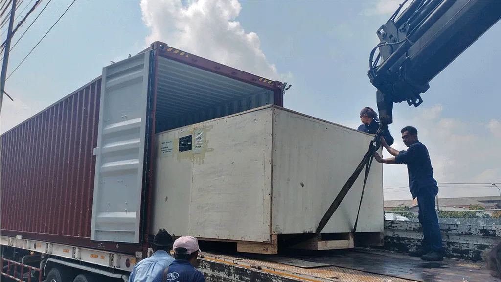 Photo of unloading packed machine from container