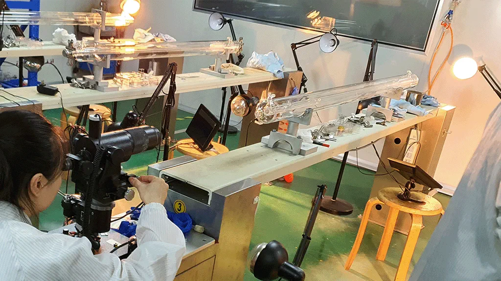 Photo of engineer assembling CO₂ laser tube