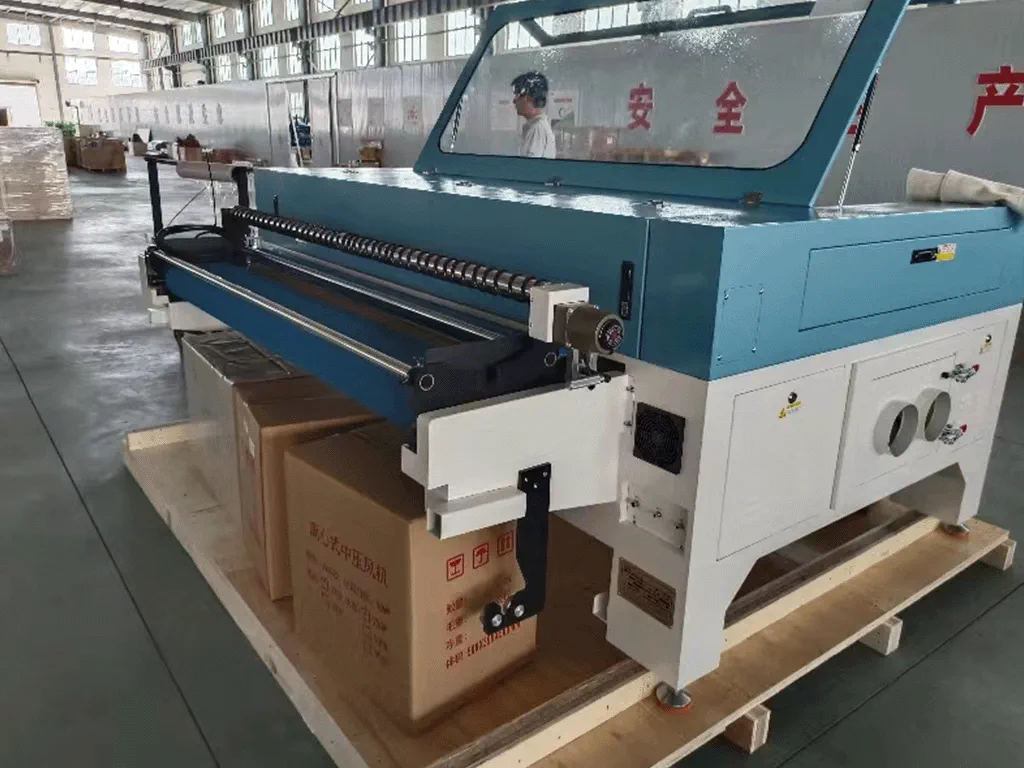 Photo of the back side of laser cutting machine with feed-in accessory attached